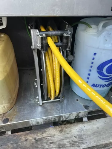 Internal high pressure hose reel fitted inside Nilfisk SH Truck cabinet to protect hose from frost damage.